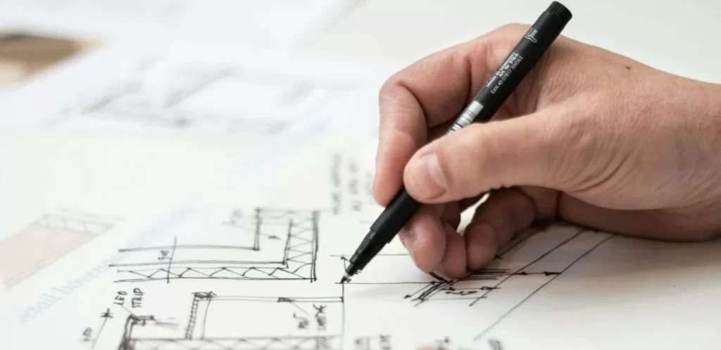 Construction planning in Sydney with contractor reviewing site plans